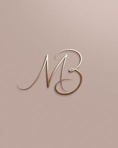 the letter m is made up of gold and silver lines on a light pink background