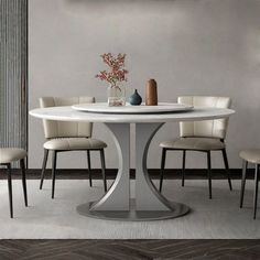 a white table with four chairs around it