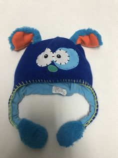 Flipeez Kid Blue Puppy Knit Beanie Hat. Condition is Pre-owned. Hat has little air pump built in that you push on straps that makes ears go up. Super cute. Smoke free home. Shipped with USPS First Class Package. Cute Blue Knitted Hat, Cute Blue Beanie Hat, Blue Novelty Hat, One Size Fits Most, Y2k Fluffy Hat, Sam Core, Blue Cat Beanie, Nostalgia Ultra, 2000s Pictures, 2000s Core