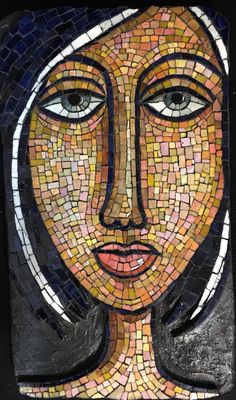 a woman's face made out of small mosaic tiles on a black background,