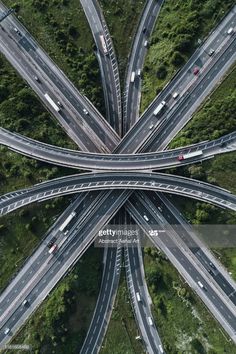 an aerial view of multiple roads in the middle of a road intersection, looking down at traffic