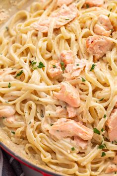 pasta with shrimp and parmesan cheese in a skillet, ready to be eaten