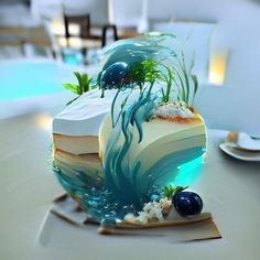 a piece of cake sitting on top of a table next to an ocean themed plate