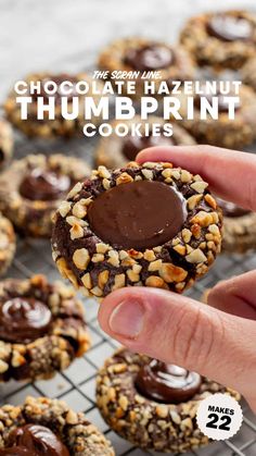 chocolate hazelnut thumbprint cookies on a cooling rack with text overlay that reads, chocolate hazelnut thumbprint cookies