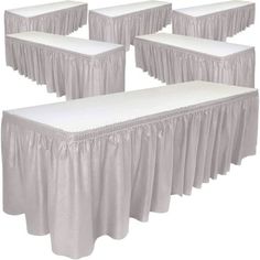 six white tablecloths with ruffled edges on them