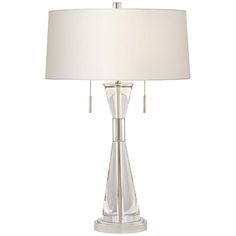 a table lamp with a white shade on it