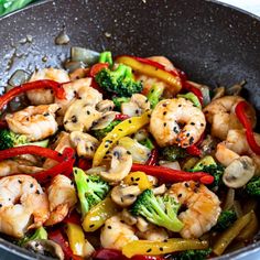 shrimp, broccoli and peppers in a wok