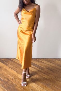 Add a touch of sophistication to your wardrobe with the Golden Glow Cowl Neck Slip Midi Dress. Chic Gold Dress For Gala, Gold Satin Sleeveless Evening Dress, Glamorous Gold Satin Dress, Gold Silk Cocktail Dress, Glamorous Bias Cut Slip Dress For Summer, Chic Gold Slip Dress For Evening, Gold Midi Dress For Gala, Gold Evening Dress For Formal Summer Events, Glamorous Silk Slip Dress With Spaghetti Straps