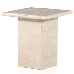 a white marble table with a square base on the top and one corner missing from it