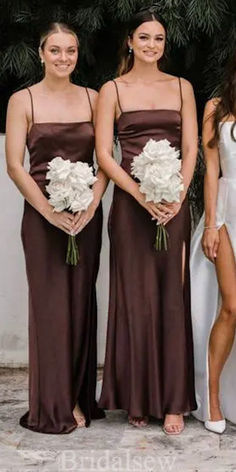 three bridesmaids in brown dresses standing next to each other