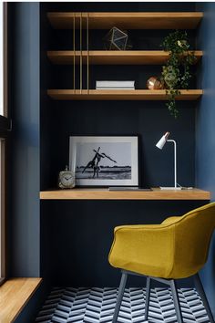 a yellow chair sitting on top of a wooden shelf