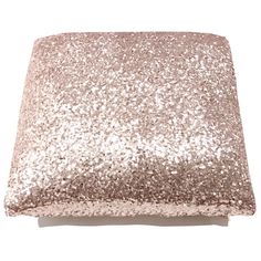 a square pillow with pink glitter on it