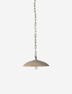 a pendant light hanging from a chain