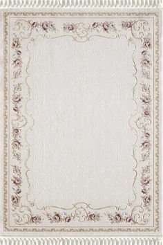 a white rug with flowers and scrolls on the border, in front of a white background