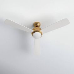 a white ceiling fan with a light on it's blades and a gold finish