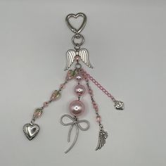 a key chain with charms and hearts on it