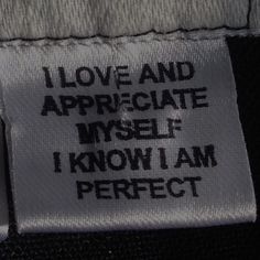 i love and appreciate myself know i am perfect tag on the back of a jacket