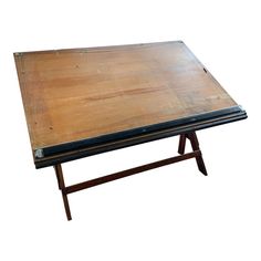 an old wooden table with two legs and a black top on white backround