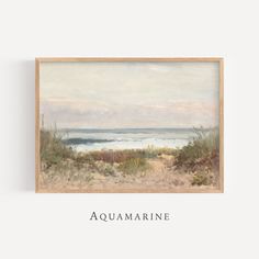 an aquamarinee painting hanging on the wall next to a wooden frame with words above it