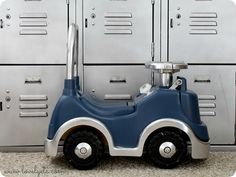 a toy car sitting in front of lockers