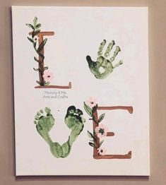 the handprints are made to look like letters with flowers and leaves on them