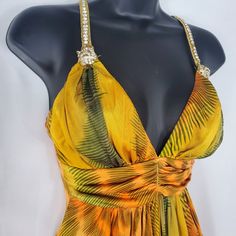 Jaguar Gold Crystal Strap Yellow Cocktail Dress. Crystal Is Shatterproof. Dry Clean Only. Tarnish Free Crystal Design. Size S. Will Fit Size M-L. Yellow Sundress For Cocktail Occasions, Elegant Yellow Mini Dress For Beach, Elegant Yellow Beach Mini Dress, Elegant Yellow Lined Mini Dress, Mustard Sleeveless Mini Dress For Party, Yellow Halter Neck Mini Dress For Evening, Yellow Sundress For Evening, Gold Sleeveless Mini Dress For Beach, Sleeveless Gold Mini Beach Dress