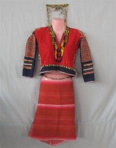 a woman's red and orange dress on display