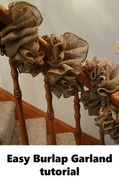 the stairs are covered with burlap garland