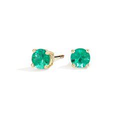 Solitaire Emerald Stud Ears - 18K Yellow Gold. These striking earrings feature deeply hued emeralds secured in classic four-prong basket settings with comfortable push back posts for pierced ears. Fortune Wheel, Emerald Studs, Emerald Stud Earrings, White Gold Studs, Emerald Earrings Studs, Yellow Gold Solitaire, Accessories Jewelry Earrings, Lab Diamonds, Gold Earrings Studs