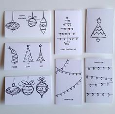 six handmade christmas cards with black ink on white paper