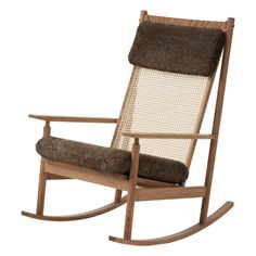 a wooden rocking chair with a brown cushion