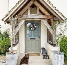 a dog sitting in front of a house