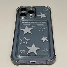 an iphone case with silver stars on it