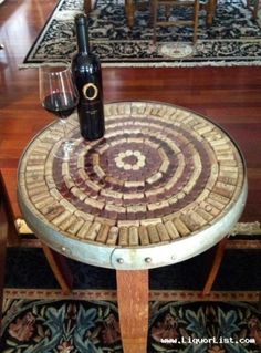 a wine bottle sitting on top of a wooden table