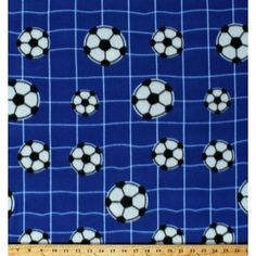 a blue background with soccer balls and net on the bottom, as well as a ruler