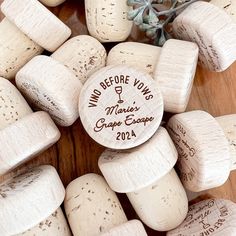 some wine corks are laying on top of each other with the names of their wines