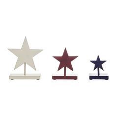 three wooden stars sitting on top of each other in front of a white background with one red, one blue and one black