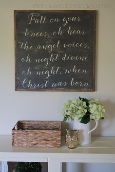 a white table topped with flowers and a chalkboard