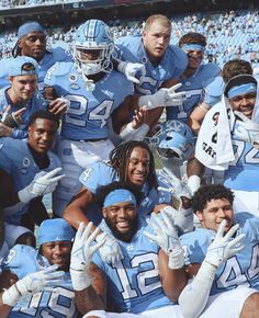 a group of football players posing for a photo