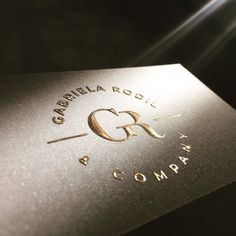 a close up of a business card with gold foil on the front and back of it