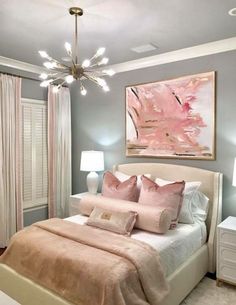 a bedroom with gray walls and pink accents