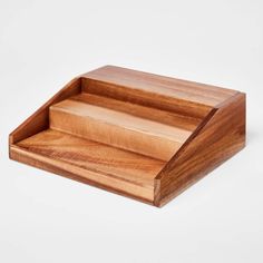 a wooden tray with two compartments on it