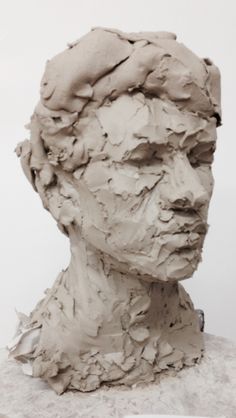 a clay sculpture of a man's head