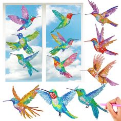 several colorful hummingbirds are flying in the sky and one is holding a pink pencil