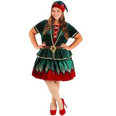 a woman in a green and red costume posing for the camera with her hands on her hips