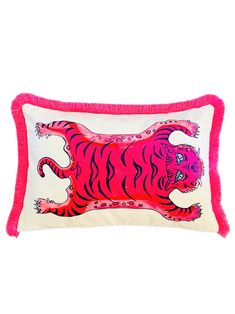 a pink and white pillow with a red tiger on it's front, in the middle