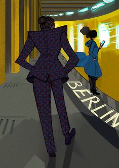 a woman in a suit walking down a hallway