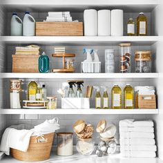 the shelves in this bathroom are filled with toiletries and other items, including soaps