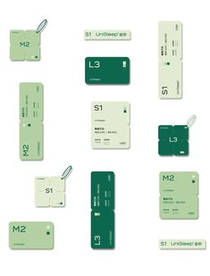 several different green and white business cards with numbers on the front, one for each card