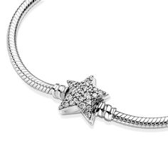 Bring celestial sparkle to your look with the Pandora Moments Asymmetric Star Clasp Snake Chain Bracelet. Hand-finished in sterling silver, the bracelet's star-shaped clasp is covered by sparkling clear cubic zirconia pavé on both sides. It can be worn with up to 16-18 desired charms and clips. Wear it on its own for a simple, understated look, or stack it with other celestial-inspired designs for a look that’s out of this world. Charms Pandora, Bracelet Pandora, Cz Bracelet, Snake Chain Bracelets, Precious Jewels, Copper Bracelet, Pandora Bracelets, Bracelet Clasps, Bracelet Collection